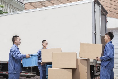 Student removals team handling boxes near Queens Park homes