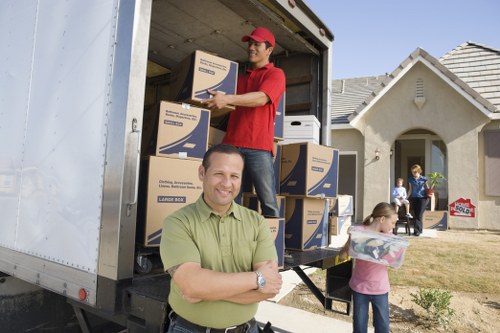 Unpacking boxes and setting up a new home in Queens Park