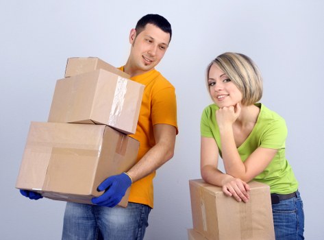 Packed boxes and furniture ready for same-day removals in Queens Park