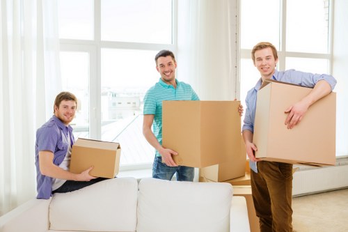 Removal van loading household items for a Queens Park relocation