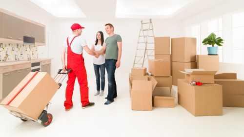 Queens Park moving team handling packed household items