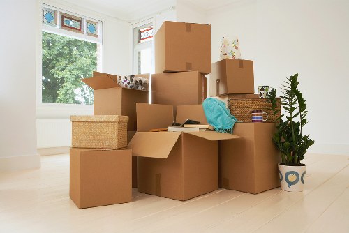 Boxes and furniture being loaded for Queens Park moving service